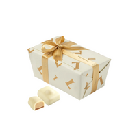 Leonidas Brighton Manon White Hazelnut chocolates in a white and gold gift box.